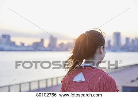 Young Japanese woman training downtown Tokyo View Large Photo Image Stock Photograph - Young Japanese woman training downtown Tokyo. Fotosearch