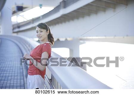 Young Japanese woman training downtown Tokyo View Large Photo Image Stock Photography - Young Japanese woman training downtown Tokyo. Fotosearch
