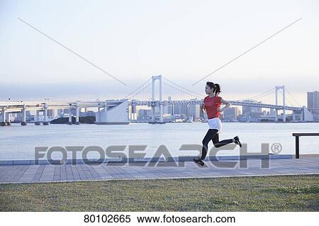 Stock Photography - Young Japanese woman training downtown Tokyo. Fotosearch