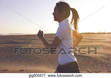 Young Japanese woman training on the beach View Large Photo Image Stock Image - Young Japanese woman training on the beach. Fotosearch