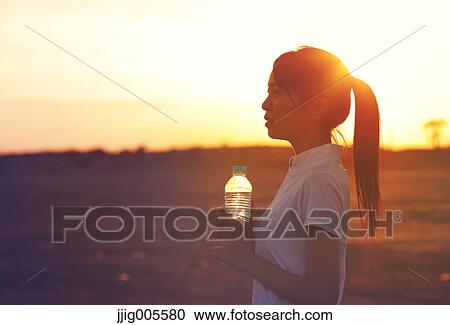 Young Japanese woman training on the beach View Large Photo Image Stock Image - Young Japanese woman training on the beach. Fotosearch