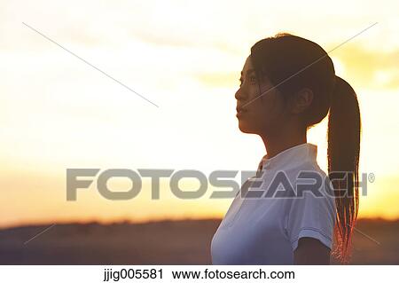 Young Japanese woman training on the beach View Large Photo Image Stock Image - Young Japanese woman training on the beach. Fotosearch
