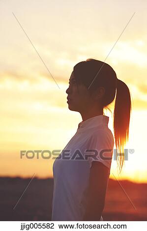 Young Japanese woman training on the beach View Large Photo Image Stock Image - Young Japanese woman training on the beach. Fotosearch
