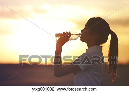 Young Japanese woman training on the beach View Large Photo Image Stock Image - Young Japanese woman training on the beach. Fotosearch