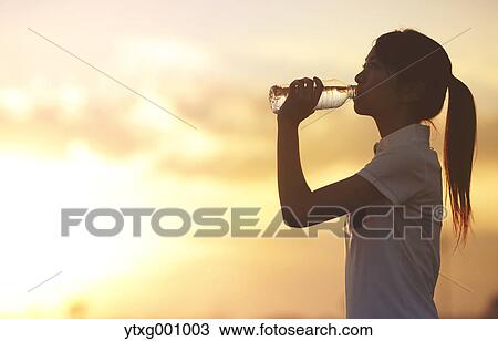 Young Japanese woman training on the beach View Large Photo Image Stock Image - Young Japanese woman training on the beach. Fotosearch