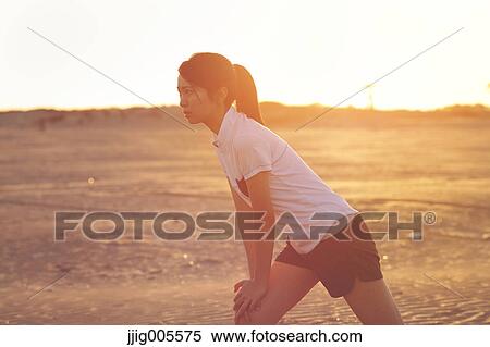Young Japanese woman training on the beach View Large Photo Image Stock Photography - Young Japanese woman training on the beach. Fotosearch