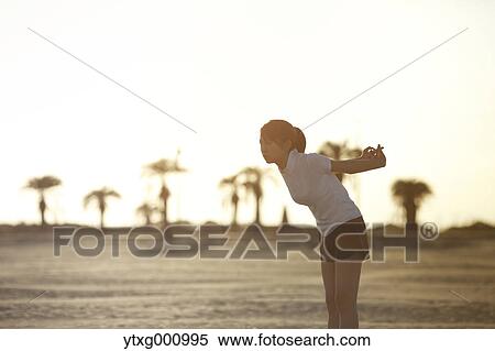 Young Japanese woman training on the beach View Large Photo Image Stock Photography - Young Japanese woman training on the beach. Fotosearch