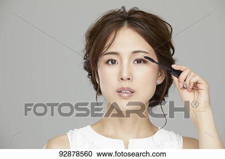 Stock Image - Attractive Japanese woman beauty portrait. Fotosearch