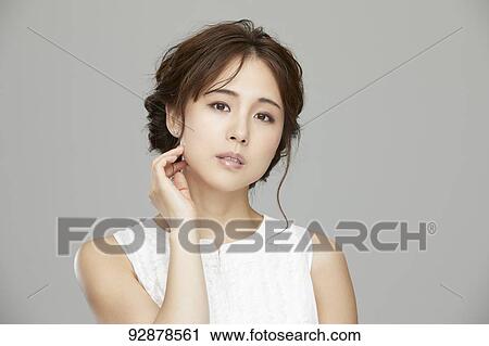 Stock Image - Attractive Japanese woman beauty portrait. Fotosearch