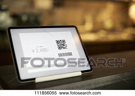 Stock Photography - Cashless payment at a restaurant. Fotosearch