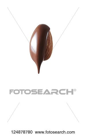 Chocolate pouring over almond View Large Photo Image Stock Image - Chocolate pouring over almond. Fotosearch