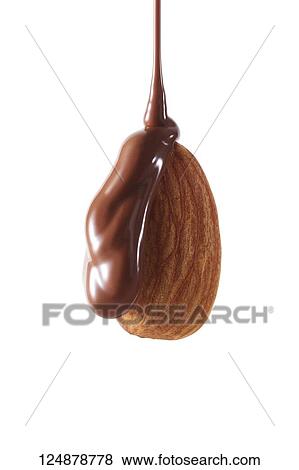 Stock Photo - Chocolate pouring over almond. Fotosearch