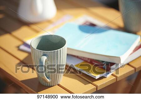 Coffee mug on a table View Large Photo Image Stock Image - Coffee mug on a table. Fotosearch