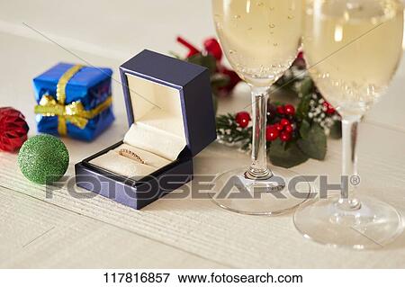 Stock Photo - Diamond ring and sparkling wine. Fotosearch