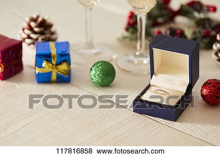 Stock Photo - Diamond ring and sparkling wine. Fotosearch