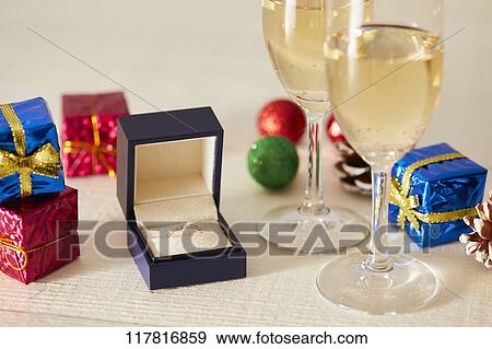 Stock Photo - Diamond ring and sparkling wine. Fotosearch