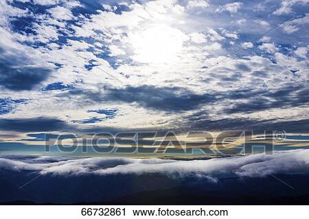 Dramatic sunrise clouds View Large Photo Image Stock Image - Dramatic sunrise clouds. Fotosearch