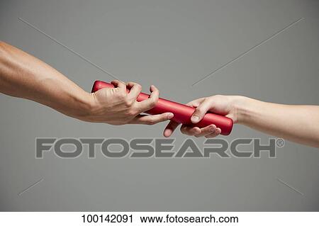 Hands holding baton View Large Photo Image Stock Image - Hands holding baton. Fotosearch