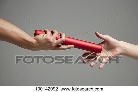 Hands holding baton View Large Photo Image Stock Image - Hands holding baton. Fotosearch