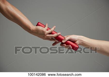 Hands holding baton View Large Photo Image Stock Photograph - Hands holding baton. Fotosearch