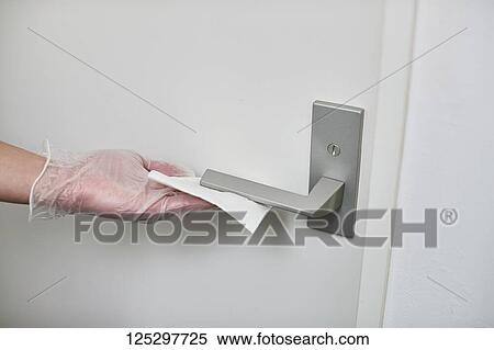 Japan man disinfecting door knob with alcohol View Large Photo Image Stock Photography - Japan man disinfecting door knob with alcohol. Fotosearch