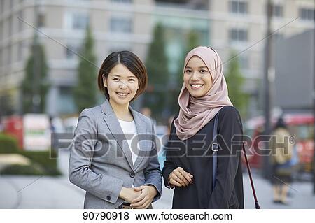 Stock Photo - Japanese and South-east Asian businesswomen. Fotosearch