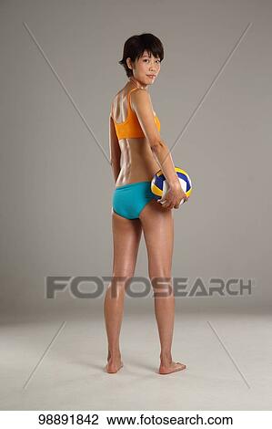 Stock Image - Japanese beach volley player in the studio. Fotosearch