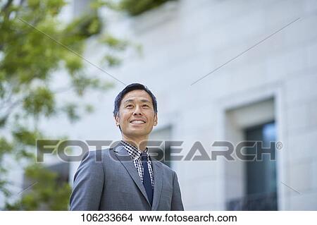 Japanese businessman downtown View Large Photo Image Picture - Japanese businessman downtown. Fotosearch