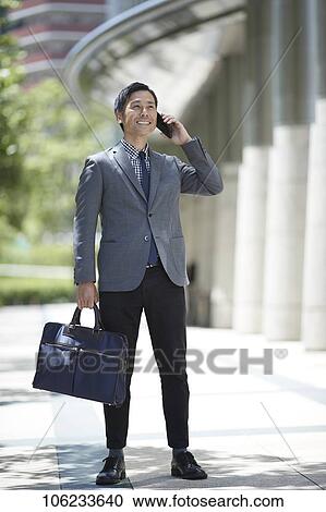 Japanese businessman downtown View Large Photo Image Stock Image - Japanese businessman downtown. Fotosearch