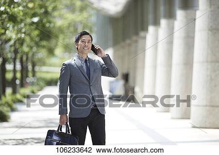 Japanese businessman downtown View Large Photo Image Stock Image - Japanese businessman downtown. Fotosearch