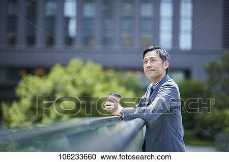 Japanese businessman downtown View Large Photo Image Stock Image - Japanese businessman downtown. Fotosearch