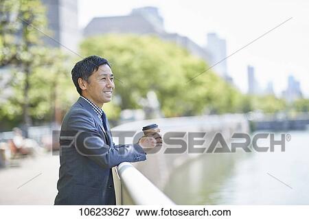 Japanese businessman downtown View Large Photo Image Stock Photo - Japanese businessman downtown. Fotosearch