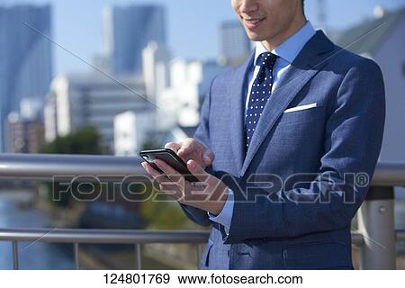 Japanese businessman downtown View Large Photo Image Stock Photo - Japanese businessman downtown. Fotosearch