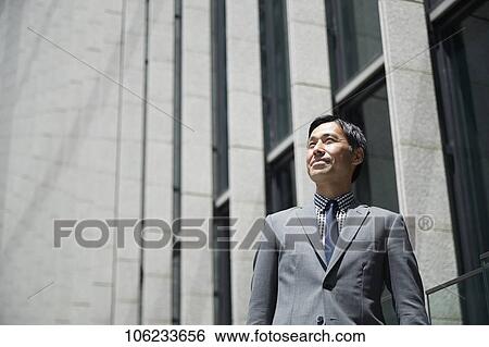 Japanese businessman downtown View Large Photo Image Stock Photograph - Japanese businessman downtown. Fotosearch