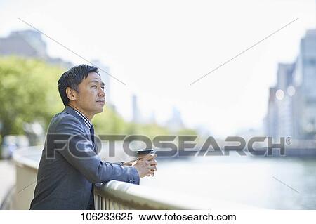Japanese businessman downtown View Large Photo Image Stock Photography - Japanese businessman downtown. Fotosearch