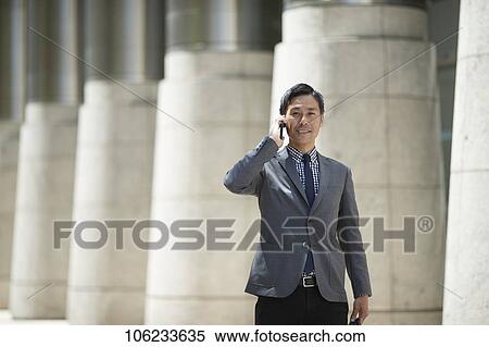 Japanese businessman downtown View Large Photo Image Stock Photography - Japanese businessman downtown. Fotosearch