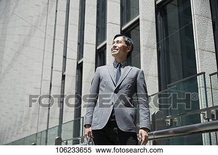 Japanese businessman downtown View Large Photo Image Stock Photography - Japanese businessman downtown. Fotosearch