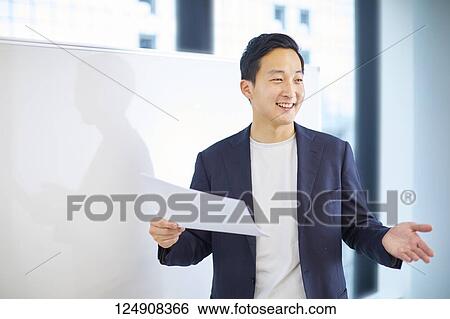 Japanese businessman in the office View Large Photo Image Stock Photograph - Japanese businessman in the office. Fotosearch