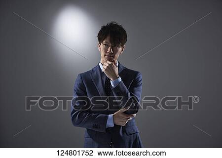 Stock Image - Japanese businessman studio portrait. Fotosearch