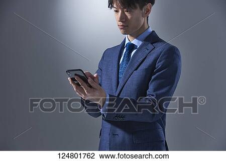Japanese businessman studio portrait View Large Photo Image Stock Image - Japanese businessman studio portrait. Fotosearch