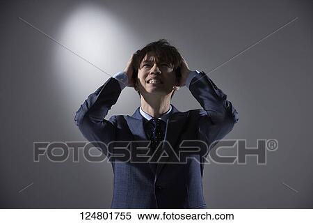 Stock Photography - Japanese businessman studio portrait. Fotosearch