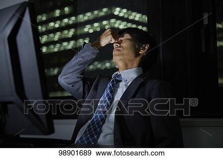 Japanese businessman working late at night View Large Photo Image Stock Photo - Japanese businessman working late at night. Fotosearch