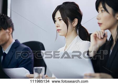 Japanese businesspeople having a meeting View Large Photo Image Picture - Japanese businesspeople having a meeting. Fotosearch