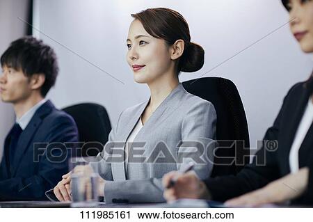 Japanese businesspeople having a meeting View Large Photo Image Stock Image - Japanese businesspeople having a meeting. Fotosearch