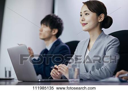 Japanese businesspeople having a meeting View Large Photo Image Stock Photography - Japanese businesspeople having a meeting. Fotosearch