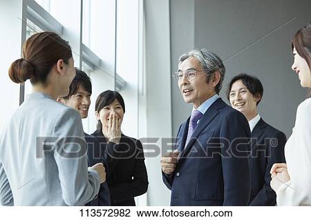 Japanese businesspeople in a meeting View Large Photo Image Stock Image - Japanese businesspeople in a meeting. Fotosearch
