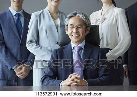 Japanese businesspeople in a meeting View Large Photo Image Stock Image - Japanese businesspeople in a meeting. Fotosearch