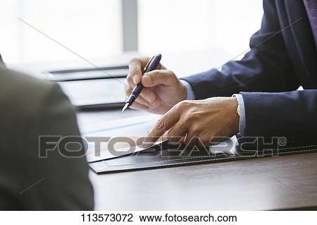 Japanese businesspeople in a meeting View Large Photo Image Stock Image - Japanese businesspeople in a meeting. Fotosearch