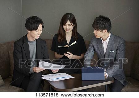 Japanese businesspeople in a meeting View Large Photo Image Stock Photo - Japanese businesspeople in a meeting. Fotosearch
