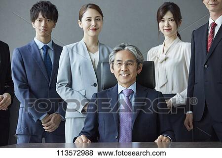 Japanese businesspeople in a meeting View Large Photo Image Stock Photo - Japanese businesspeople in a meeting. Fotosearch